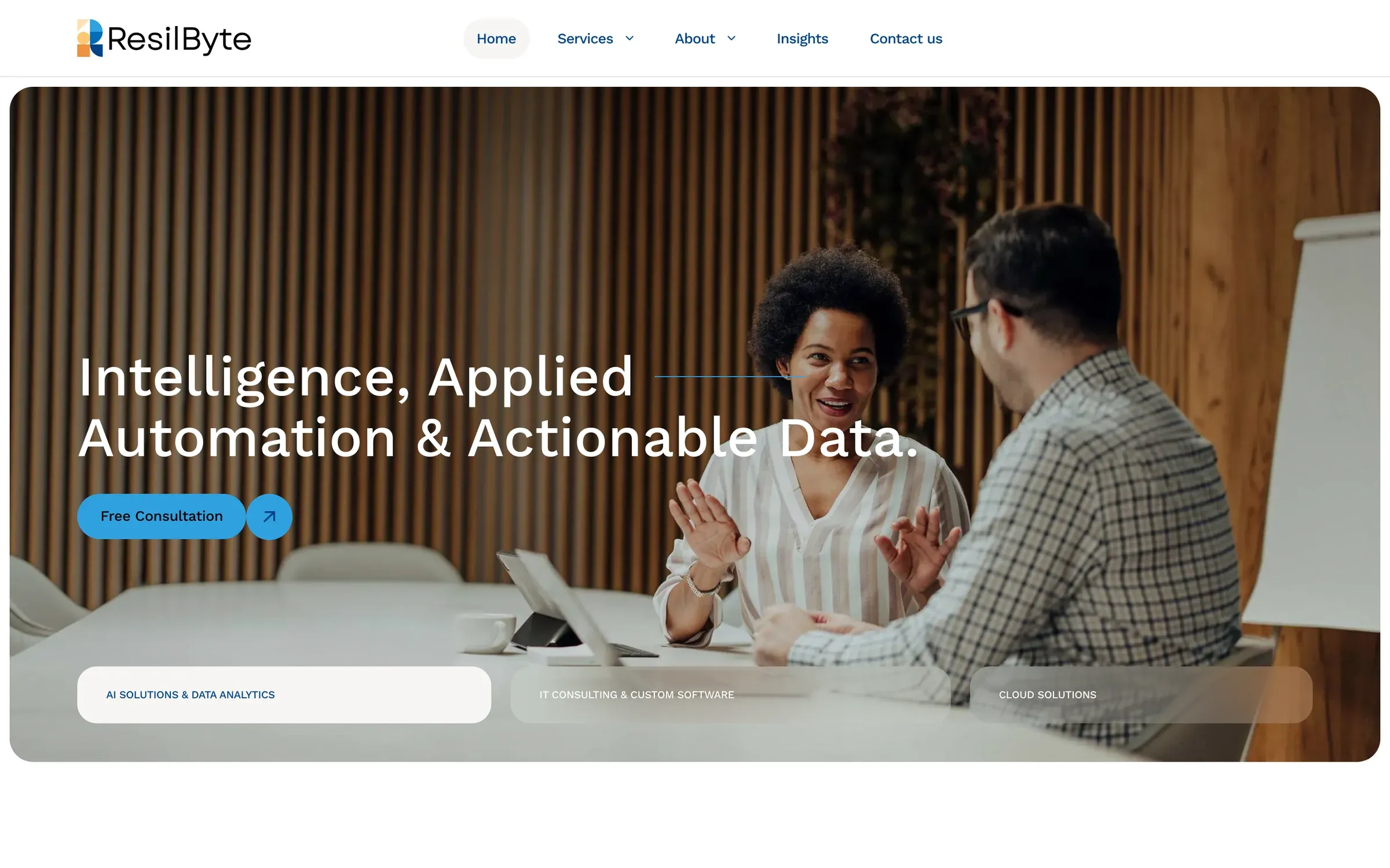 ResilByte home page: two colleagues talking in a meeting room under the headline "Intelligence, Applied Automation & Actionable Data."
