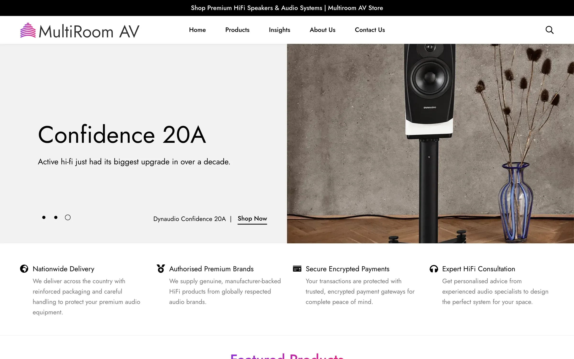 MultiroomAV home page: a Dynaudio Confidence 20A speaker on a stand beside a vase of dried flowers
